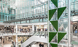 Maintenance-free moss triangles in moss green installed around the lift in the Rostocker Hof shopping centre