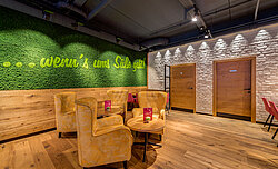 Brand message in apple green integrated into moss green moss wall, Evergreen Moss Premium, Freund, cafe in Vienna
