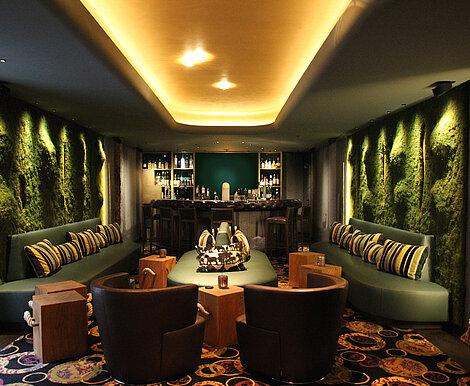 Greenwood moss walls with 3D substrate creating an earthy ambience in a private green reception room